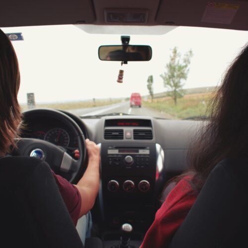 Two Woman Sitting Inside Vehicle