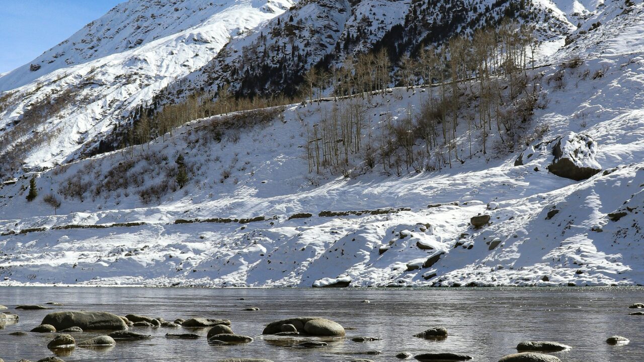 Snowcapped Mountains by the River