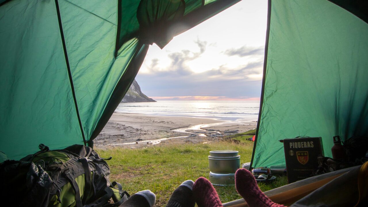 Two People Lying Inside Tent