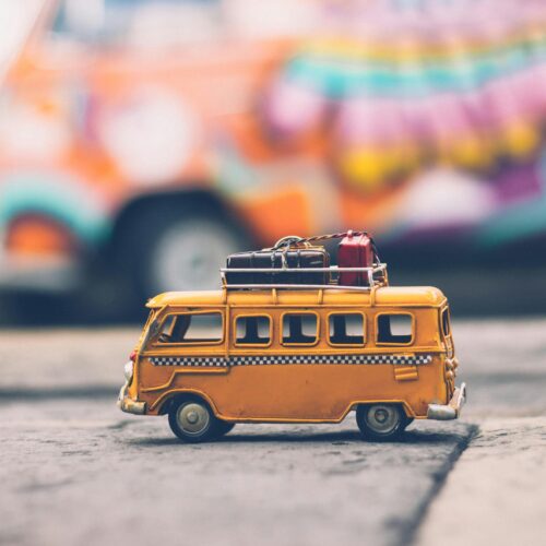 Selective Focus Photography of Yellow School Bus Die-cast