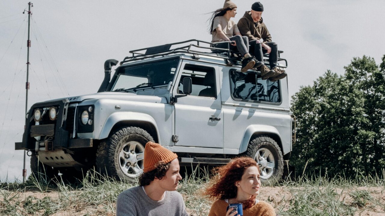 Couple Sitting on Black Suv