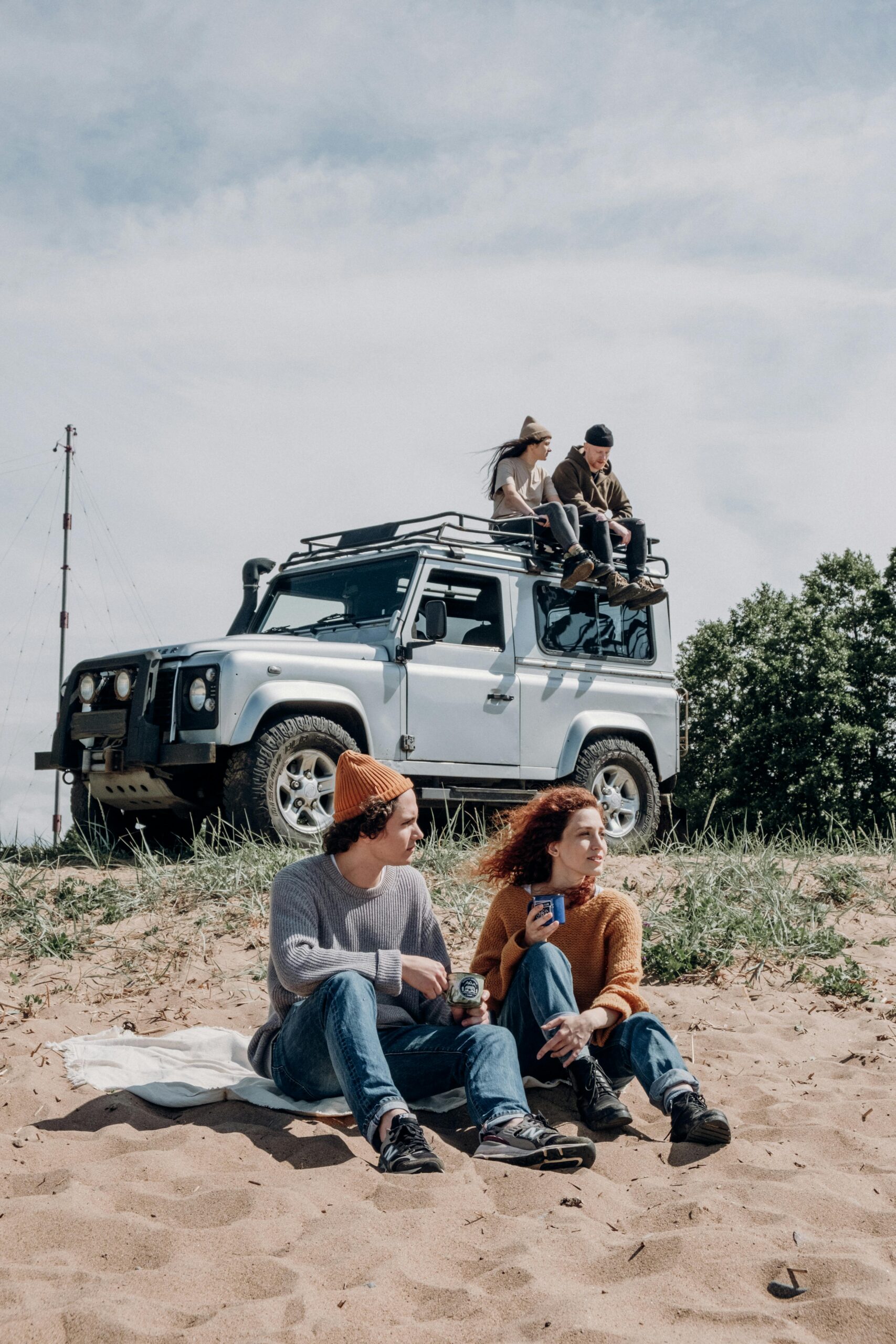 Couple Sitting on Black Suv