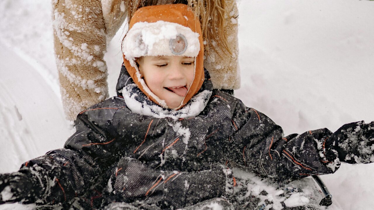 A Mother and Child Having Fun Playing in the Snow