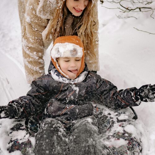 A Mother and Child Having Fun Playing in the Snow