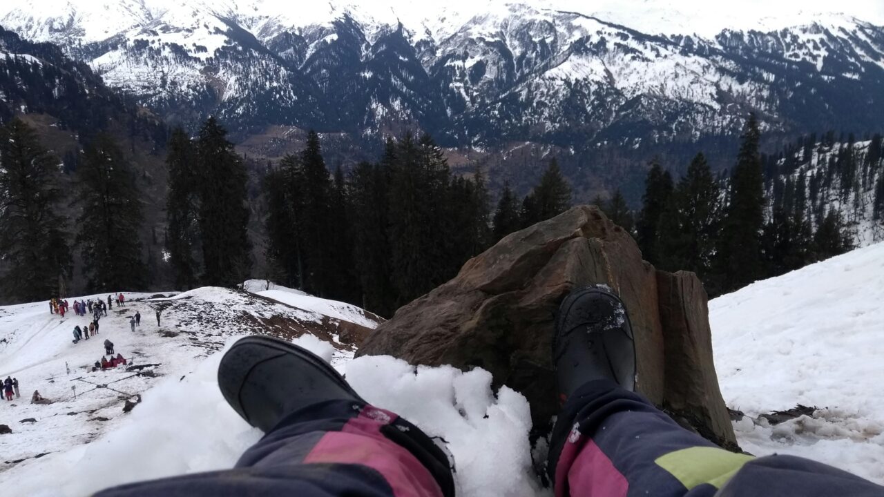 Person Wearing Black Boots At Snowy Mountain