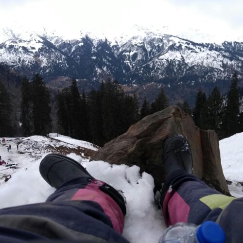 Person Wearing Black Boots At Snowy Mountain