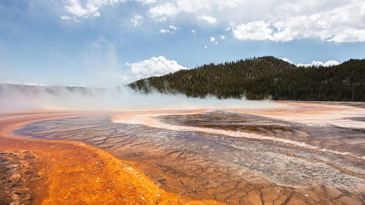 Landscape of a Steaming Ground by a Hill in the Yellowstone National Park, USA