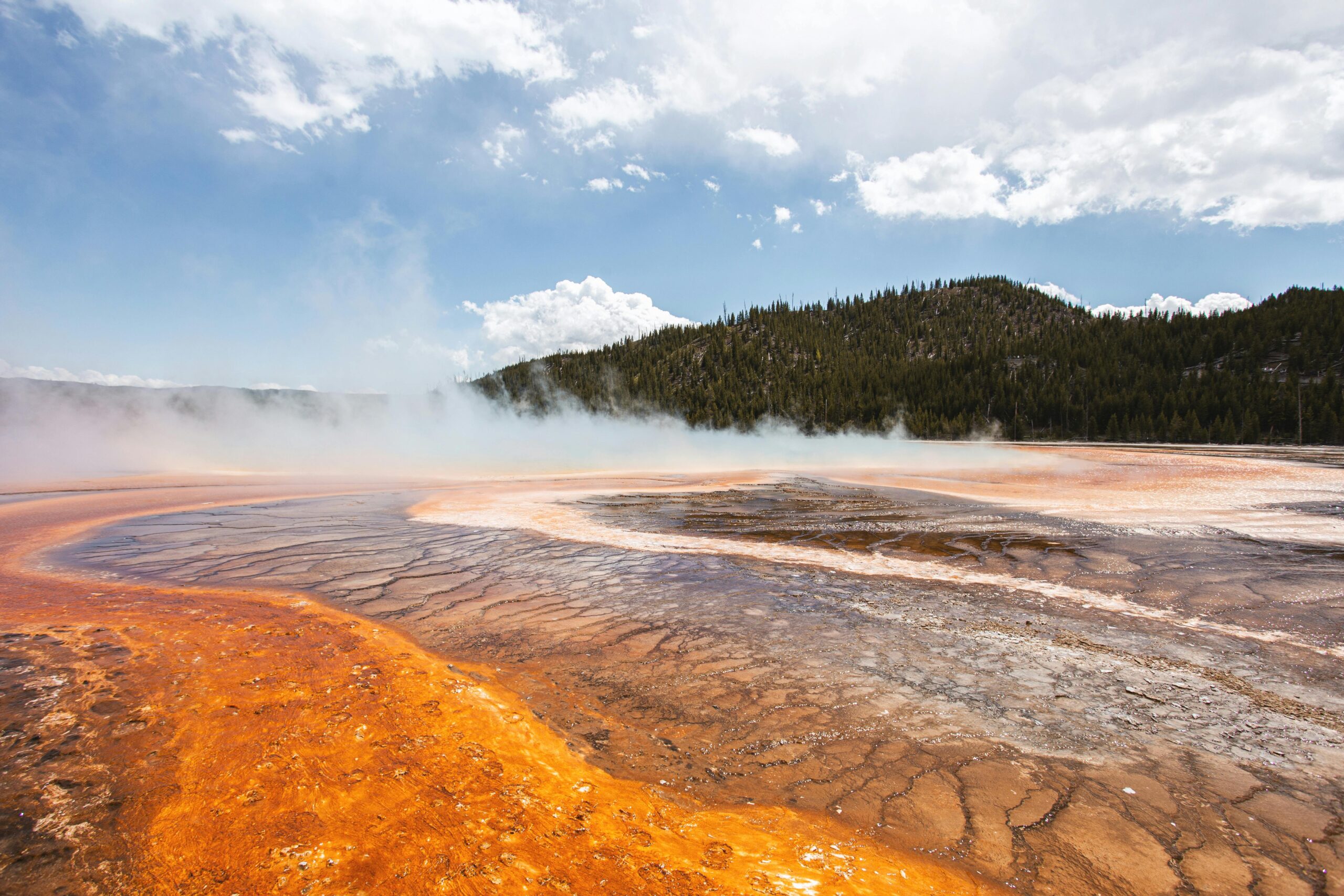 Landscape of a Steaming Ground by a Hill in the Yellowstone National Park, USA